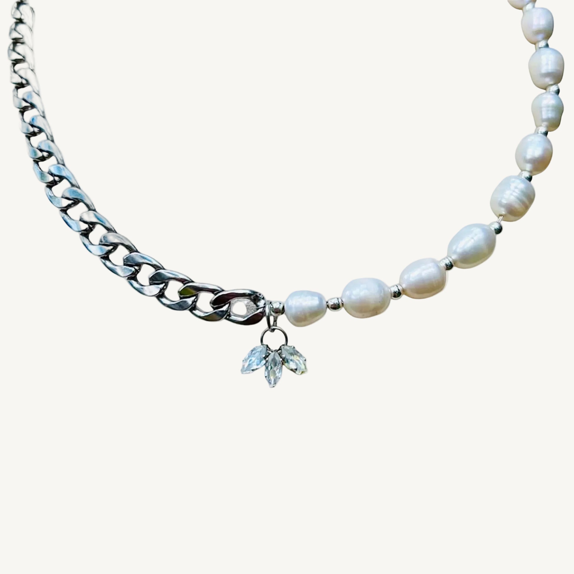 Necklace with pearls and a silver chain on a white background