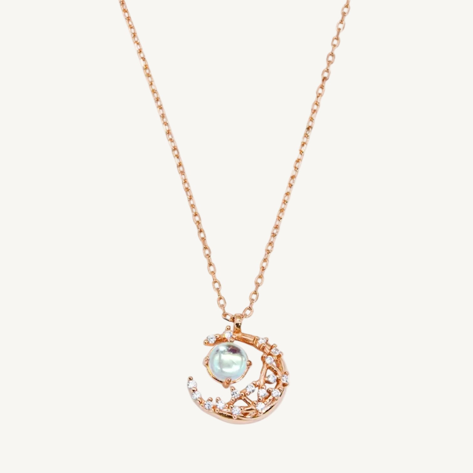 925 sterling silver, rose gold-plated necklace with natural moonstone pendant on a white background
